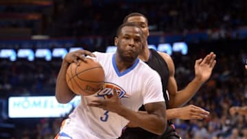 Mar 31, 2016; Oklahoma City, OK, USA; Oklahoma City Thunder guard Dion Waiters (3) drives to the basket in front of Los Angeles Clippers forward Wesley Johnson (33) during the fourth quarter at Chesapeake Energy Arena. Mandatory Credit: Mark D. Smith-USA TODAY Sports