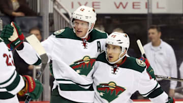 Nov 10, 2016; Pittsburgh, PA, USA; Minnesota Wild center Eric Staal (12) celebrates his goal with defenseman Jared Spurgeon (46) against the Pittsburgh Penguins during the third period at the PPG Paints Arena. Minnesota won 4-2. Mandatory Credit: Charles LeClaire-USA TODAY Sports