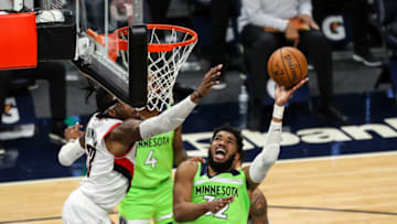 Karl-Anthony Towns of the Minnesota Timberwolves goes up for a shot against the Portland Trail Blazers. (Photo by David Berding/Getty Images)