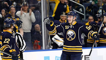 Dec 16, 2016; Buffalo, NY, USA; Buffalo Sabres center Johan Larsson (22) celebrates with defenseman Rasmus Ristolainen (55) after scoring a goal against the New York Islanders during the second period at KeyBank Center. Mandatory Credit: Kevin Hoffman-USA TODAY Sports