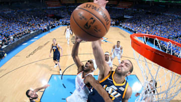 OKLAHOMA CITY, OK - APRIL 15: Rudy Gobert #27 of the Utah Jazz attempts to block a shot against the Oklahoma City Thunder during Game One of Round One of the 2018 NBA Playoffs on April 15, 2018 at Chesapeake Energy Arena in Oklahoma City, Oklahoma. NOTE TO USER: User expressly acknowledges and agrees that, by downloading and/or using this photograph, user is consenting to the terms and conditions of the Getty Images License Agreement. Mandatory Copyright Notice: Copyright 2018 NBAE (Photo by Layne Murdoch/NBAE via Getty Images)
