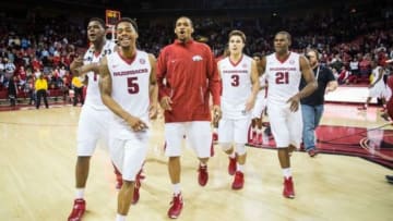 Jan 27, 2016; Fayetteville, AR, USA; Arkansas Razorbacks forward Trey Thompson (1) guard Anthlon Bell (5) forward Keaton Miles (55) guard Dusty Hannahs (3) and guard Manuale Watkins leave the court to celebrate with fans after defeating the Texas A&M Aggies at Bud Walton Arena. The Razorbacks won 74-71. Mandatory Credit: Gunnar Rathbun-USA TODAY Sports