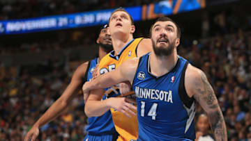 DENVER, CO - NOVEMBER 15: Nikola Pekovic #14 of the Minnesota Timberwolves and Timofey Mozgov #25 of the Denver Nuggets battle for rebounding position. (Photo by Doug Pensinger/Getty Images)