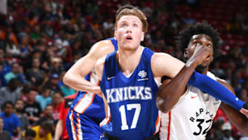 LAS VEGAS, NV - JULY 9: Ignas Brazdeikis #17 of the New York Knicks jocks for a position during the game against Jordon Varnado #32 of the Toronto Raptors during Day 5 of the 2019 Las Vegas Summer League on July 9, 2019 at the Thomas & Mack Center in Las Vegas, Nevada. NOTE TO USER: User expressly acknowledges and agrees that, by downloading and or using this Photograph, user is consenting to the terms and conditions of the Getty Images License Agreement. Mandatory Copyright Notice: Copyright 2019 NBAE (Photo by Garrett Ellwood/NBAE via Getty Images)