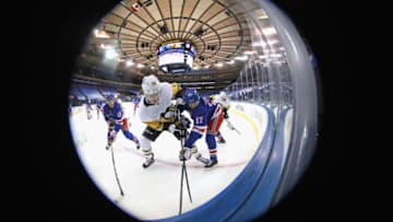 Jan 30, 2021; New York, New York, USA; Sam Lafferty #18 of the Pittsburgh Penguins and Kevin Rooney #17 of the New York Rangers battle for the puck during the third period at Madison Square Garden on January 30, 2021 in New York City. Mandatory Credit: Bruce Bennett/POOL PHOTOS-USA TODAY Sports