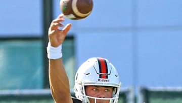 Quarterback Malik Rosier (12) passes the ball during drills as the University of Miami opens fall football camp at Greentree Field on Tuesday, Aug. 1, 2017. (Al Diaz/Miami Herald/TNS via Getty Images)