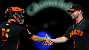 SAN FRANCISCO, CA - SEPTEMBER 15: Will Smith #13 of the San Francisco Giants celebrates with Nick Hundley #5 after the game against the Colorado Rockies at AT&T Park on September 15, 2018 in San Francisco, California. The San Francisco Giants defeated the Colorado Rockies 3-0. (Photo by Jason O. Watson/Getty Images)