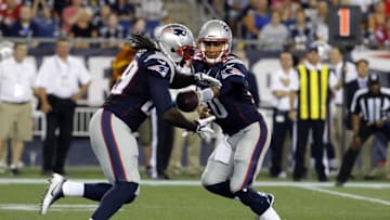 Aug 18, 2016; Foxborough, MA, USA; New England Patriots quarterback Jimmy Garoppolo (10) hand off the ball to New England Patriots running back LeGarrette Blount (29) against the Chicago Bears in the second quarter at Gillette Stadium. Mandatory Credit: David Butler II-USA TODAY Sports