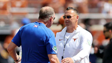 AUSTIN, TEXAS - SEPTEMBER 30: Head coach Steve Sarkisian of the Texas Longhorns talks with head coach Lance Leipold of the Kansas Jayhawks before the game at Darrell K Royal-Texas Memorial Stadium on September 30, 2023 in Austin, Texas. (Photo by Tim Warner/Getty Images)