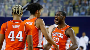 Mar 2, 2021; Ann Arbor, Michigan, USA; Illinois Fighting Illini guard Adam Miller (44) Illinois Fighting Illini guard Jacob Grandison (3) and Illinois Fighting Illini guard Da'Monte Williams (20) celebrate during the first half against the Michigan Wolverines at Crisler Center. Mandatory Credit: Rick Osentoski-USA TODAY Sports