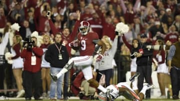 Nov 29, 2014; Tuscaloosa, AL, USA; Alabama Crimson Tide wide receiver Amari Cooper (9) catches a touchdown pass in the third quarter past Auburn Tigers defensive back Jonathon Mincy (6) at Bryant-Denny Stadium. Mandatory Credit: John David Mercer-USA TODAY Sports