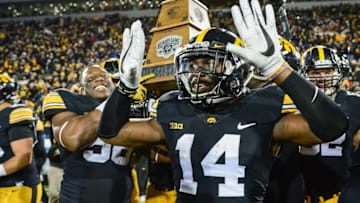 Nov 25, 2016; Iowa City, IA, USA; Iowa Hawkeyes defensive back Desmond King (14) celebrates after the game against the Nebraska Cornhuskers at Kinnick Stadium. Iowa won 40-10 and secured the Heroes Game trophy. Mandatory Credit: Jeffrey Becker-USA TODAY Sports