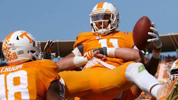 Nov 12, 2016; Knoxville, TN, USA; Tennessee Volunteers quarterback Joshua Dobbs (11) celebrates after scoring a touchdown against the Kentucky Wildcats during the first half at Neyland Stadium. Mandatory Credit: Randy Sartin-USA TODAY Sports