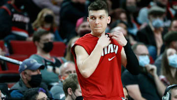 PORTLAND, OREGON - JANUARY 05: Tyler Herro # 14 of the Miami Heat waits to enter the game during the first half against the Portland Trail Blazers at Moda Center on January 05, 2022 in Portland, Oregon. NOTE TO USER: User expressly acknowledges and agrees that, by downloading and or using this photograph, User is consenting to the terms and conditions of the Getty Images License Agreement. (Photo by Soobum Im/Getty Images)