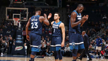 MINNEAPOLIS, MN - DECEMBER 3: Jimmy Butler #23 of the Minnesota Timberwolves, Tyus Jones #1 of the Minnesota Timberwolves, and Gorgui Dieng #5 of the Minnesota Timberwolves celebrate on the court against the LA Clippers on December 3, 2017 at Target Center in Minneapolis, Minnesota. NOTE TO USER: User expressly acknowledges and agrees that, by downloading and or using this Photograph, user is consenting to the terms and conditions of the Getty Images License Agreement. Mandatory Copyright Notice: Copyright 2017 NBAE (Photo by David Sherman/NBAE via Getty Images)