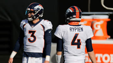 CHARLOTTE, NORTH CAROLINA - DECEMBER 13: Quarterbacks Drew Lock #3 and Brett Rypien #4of the Denver Broncos look on prior to their game against the Carolina Panthers at Bank of America Stadium on December 13, 2020 in Charlotte, North Carolina. (Photo by Jared C. Tilton/Getty Images)
