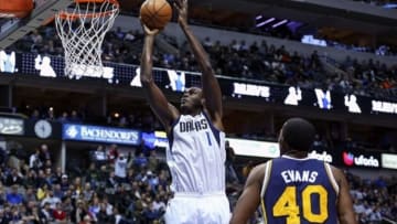 Nov 22, 2013; Dallas, TX, USA; Dallas Mavericks center Samuel Dalembert (1) scores over Utah Jazz small forward Jeremy Evans (40) during the second half at American Airlines Center. Mandatory Credit: Kevin Jairaj-USA TODAY Sports