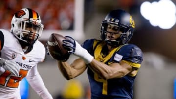 Nov 14, 2015; Berkeley, CA, USA; California Golden Bears wide receiver Trevor Davis (9) catches the ball against Oregon State Beavers cornerback Kendall Hill (12) during the first quarter at Memorial Stadium. Mandatory Credit: Kelley L Cox-USA TODAY Sports