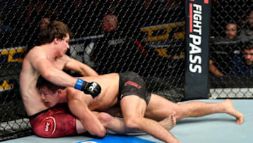 CALGARY, AB - JULY 28: (R-L) Alexander Hernandez takes down Olivier Aubin-Mercier of Canada in their lightweight bout during the UFC Fight Night event at Scotiabank Saddledome on July 28, 2018 in Calgary, Alberta, Canada. (Photo by Jeff Bottari/Zuffa LLC/Zuffa LLC via Getty Images)