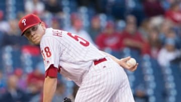 May 13, 2016; Philadelphia, PA, USA; Philadelphia Phillies starting pitcher Jeremy Hellickson (58) checks a Cincinnati Reds base runner at Citizens Bank Park. The Philadelphia Phillies won 3-2. Mandatory Credit: Bill Streicher-USA TODAY Sports