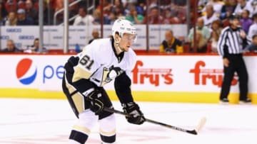 Oct 10, 2015; Glendale, AZ, USA; Pittsburgh Penguins left wing Sergei Plotnikov (61) against the Arizona Coyotes during the home opener at Gila River Arena. Mandatory Credit: Mark J. Rebilas-USA TODAY Sports