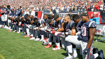 FOXBORO, MA - SEPTEMBER 24: Members of the New England Patriots kneel during the National Anthem before a game against the Houston Texans at Gillette Stadium on September 24, 2017 in Foxboro, Massachusetts. (Photo by Jim Rogash/Getty Images)