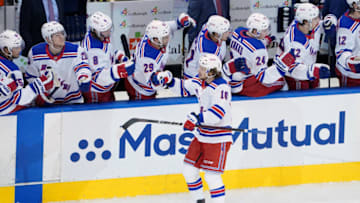 TORONTO, ONTARIO - AUGUST 03: Artemi Panarin #10 of the New York Rangers celebrates with teammates after scoring a goal against the Carolina Hurricanes in Game Two of the Eastern Conference Qualification Round prior to the 2020 NHL Stanley Cup Playoffs at Scotiabank Arena on August 3, 2020 in Toronto, Ontario, Canada. (Photo by Andre Ringuette/Freestyle Photo/Getty Images)