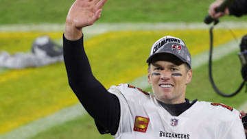 GREEN BAY, WISCONSIN - JANUARY 24: Tom Brady #12 of the Tampa Bay Buccaneers celebrates their 31 to 26 win over the Green Bay Packers during the NFC Championship game at Lambeau Field on January 24, 2021 in Green Bay, Wisconsin. (Photo by Stacy Revere/Getty Images)