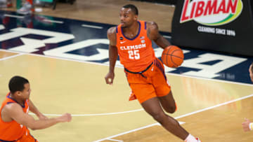 Jan 20, 2021; Atlanta, Georgia, USA; Clemson Tigers forward Aamir Simms (25) dribbles against the Georgia Tech Yellow Jackets in the first half at McCamish Pavilion. Mandatory Credit: Brett Davis-USA TODAY Sports