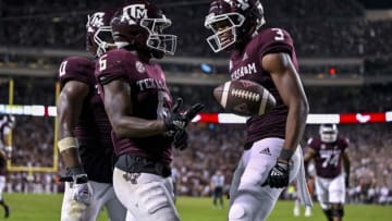 Sep 17, 2022; College Station, Texas, USA; Texas A&M Aggies running back Devon Achane (6) and wide receiver Devin Price (3) celebrates a touchdown against the Miami Hurricanes during the second half at Kyle Field. Mandatory Credit: Jerome Miron-USA TODAY Sports