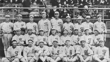 Group shot of the 1919 White Sox. They would after this year be known as the "Black Sox Scandal" team, due to the allegation that eight members of the team accepted bribes to lose the 1919 World Series to the Cincinnati Reds. These eight players, pitchers Eddie Cicotte and Claude "Lefty" Williams, first baseman Charles "Chick" Gandil, shortstop Charles "Swede"Risberg, third baseman George "Buck" Weaver, outfielders Joe "Shoeless Joe" Jackson and Oscar "Happy" Felsch, and pinch hitter Fred McMullin, were banned from the game of baseball for life.