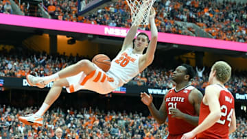 Feb 27, 2016; Syracuse, NY, USA; Syracuse Orange forward Tyler Lydon (20) reacts following a dunk in front of North Carolina State Wolfpack forward BeeJay Anya (21) and guard Maverick Rowan (24) during the second half at the Carrier Dome. Syracuse defeated North Carolina State 75-66. Mandatory Credit: Rich Barnes-USA TODAY Sports