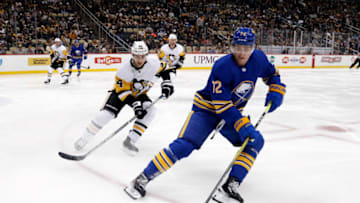 Dec 10, 2022; Pittsburgh, Pennsylvania, USA; Buffalo Sabres center Tage Thompson (72) skates with the puck as Pittsburgh Penguins defenseman Jan Rutta (44) chases during the second period at PPG Paints Arena. Mandatory Credit: Charles LeClaire-USA TODAY Sports