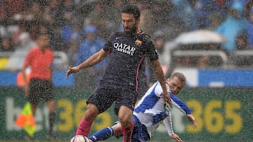 LA CORUNA, SPAIN - MARCH 12: Alex Bergantinos of RC Deportivo La Coruna competes for the ball with Arda Turan of FC Barcelona during the La Liga match between RC Deportivo La Coruna and FC Barcelona at Riazor Stadium on March 12, 2017 in La Coruna, Spain. (Photo by Octavio Passos/Getty Images)