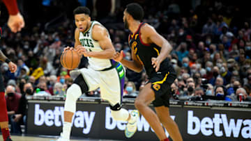 Jan 26, 2022; Cleveland, Ohio, USA; Milwaukee Bucks forward Giannis Antetokounmpo (34) drives against Cleveland Cavaliers center Evan Mobley (4) in the fourth quarter at Rocket Mortgage FieldHouse. Mandatory Credit: David Richard-USA TODAY Sports