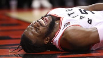 May 11, 2016; Toronto, Ontario, CAN; Toronto Raptors forward DeMarre Carroll (5) reacts after injuring himself against the Miami Heat in game five of the second round of the NBA Playoffs at Air Canada Centre. The Raptors beat the Heat 99-91. Mandatory Credit: Tom Szczerbowski-USA TODAY Sports