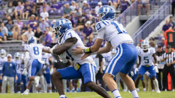 Sep 10, 2022; Evanston, Illinois, USA; Duke Blue Devils quarterback Riley Leonard (13) hands off the ball to running back Jordan Waters (7) during the first quarter against the Northwestern Wildcats at Ryan Field. Mandatory Credit: Patrick Gorski-USA TODAY Sports