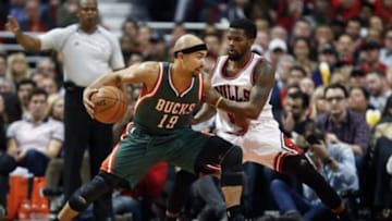 Apr 27, 2015; Chicago, IL, USA; Milwaukee Bucks guard Jerryd Bayless (19) is defended by Chicago Bulls guard Aaron Brooks (0) in game five of the first round of the 2015 NBA Playoffs at United Center. The Bucks won 94-88. Mandatory Credit: Kamil Krzaczynski-USA TODAY Sports