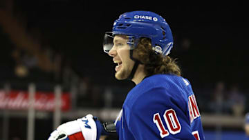NEW YORK, NEW YORK - APRIL 25: Artemi Panarin #10 of the New York Rangers talks to his teammates during warm ups before the game against the Buffalo Sabres at Madison Square Garden on April 25, 2021 in New York City. (Photo by Elsa/Getty Images)