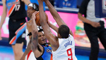 May 16, 2021; Oklahoma City, Oklahoma, USA; LA Clippers center Serge Ibaka (9) defends a shot by Oklahoma City Thunder forward Josh Hall (15) during the second quarter at Chesapeake Energy Arena. Mandatory Credit: Alonzo Adams-USA TODAY Sports