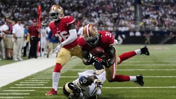 Sep 26, 2013; St. Louis, MO, USA; San Francisco 49ers strong safety Donte Whitner (31) intercepts a pass intended for St. Louis Rams wide receiver Brian Quick (83) during the first half at the Edward Jones Dome. Mandatory Credit: Jeff Curry-USA TODAY Sports