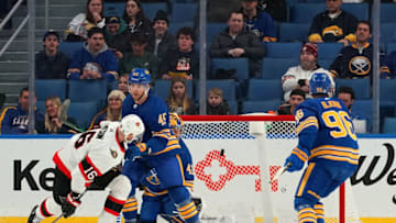 BUFFALO, NY - FEBRUARY 17: Austin Watson #16 of the Ottawa Senators scores the winning goal against Craig Anderson #41 as Casey Fitzgerald #45 and Anders Bjork #96 of the Buffalo Sabres defends during the third period at KeyBank Center on February 17, 2022 in Buffalo, New York. (Photo by Kevin Hoffman/Getty Images)