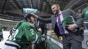 Apr 11, 2014; Dallas, TX, USA; Dallas Stars center Cody Eakin (20) and center Rich Peverley (17) celebrate the win over the St. Louis Blues at the American Airlines Center. The Stars shut out the Blues 3-0 and clinched the final playoff spot in the western conference. Mandatory Credit: Jerome Miron-USA TODAY Sports