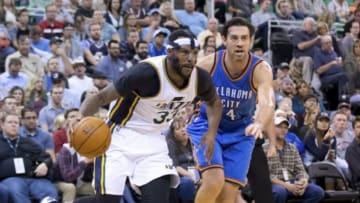 Oct 20, 2015; Salt Lake City, UT, USA; Utah Jazz forward Trevor Booker (33) dribbles the ball in front of Oklahoma City Thunder forward Nick Collison (4) during the second half at EnergySolutions Arena. Oklahoma City won 113-102. Mandatory Credit: Russ Isabella-USA TODAY Sports
