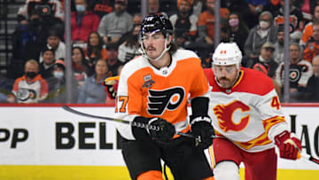 Nov 16, 2021; Philadelphia, Pennsylvania, USA; Philadelphia Flyers center Zack MacEwen (17) and Calgary Flames defenseman Erik Gudbranson (44) battle for the puck during the second period at Wells Fargo Center. Mandatory Credit: Eric Hartline-USA TODAY Sports