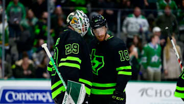 Feb 27, 2022; Dallas, Texas, USA; Dallas Stars goaltender Jake Oettinger (29) and left wing Michael Raffl (18) celebrate the win over the Buffalo Sabres at the American Airlines Center. Mandatory Credit: Jerome Miron-USA TODAY Sports