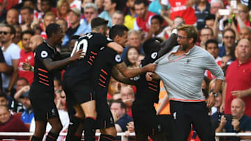 LONDON, ENGLAND - AUGUST 14: Sadio Mane of Liverpool and team mates celebrate his goal with Jurgen Klopp, Manager of Liverpool during the Premier League match between Arsenal and Liverpool at Emirates Stadium on August 14, 2016 in London, England. (Photo by Mike Hewitt/Getty Images)