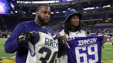 Sep 1, 2016; Minneapolis, MN, USA; Minnesota Vikings defensive tackle Toby Johnson (left) and Los Angeles Rams running back Todd Gurley pose after exchanging jerseys during a NFL game at U.S. Bank Stadium. Mandatory Credit: Kirby Lee-USA TODAY Sports