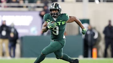 EAST LANSING, MICHIGAN - NOVEMBER 13: Kenneth Walker III #9 of the Michigan State Spartans runs up the field against the Maryland Terrapins in the first half at Spartan Stadium on November 13, 2021 in East Lansing, Michigan. (Photo by Mike Mulholland/Getty Images)