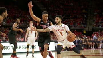 Jan 1, 2017; College Park, MD, USA; Maryland Terrapins guard Jaylen Brantley (1) attempts to drive past Nebraska Cornhuskers guard Evan Taylor (11) at Xfinity Center. Mandatory Credit: Rafael Suanes-USA TODAY Sports